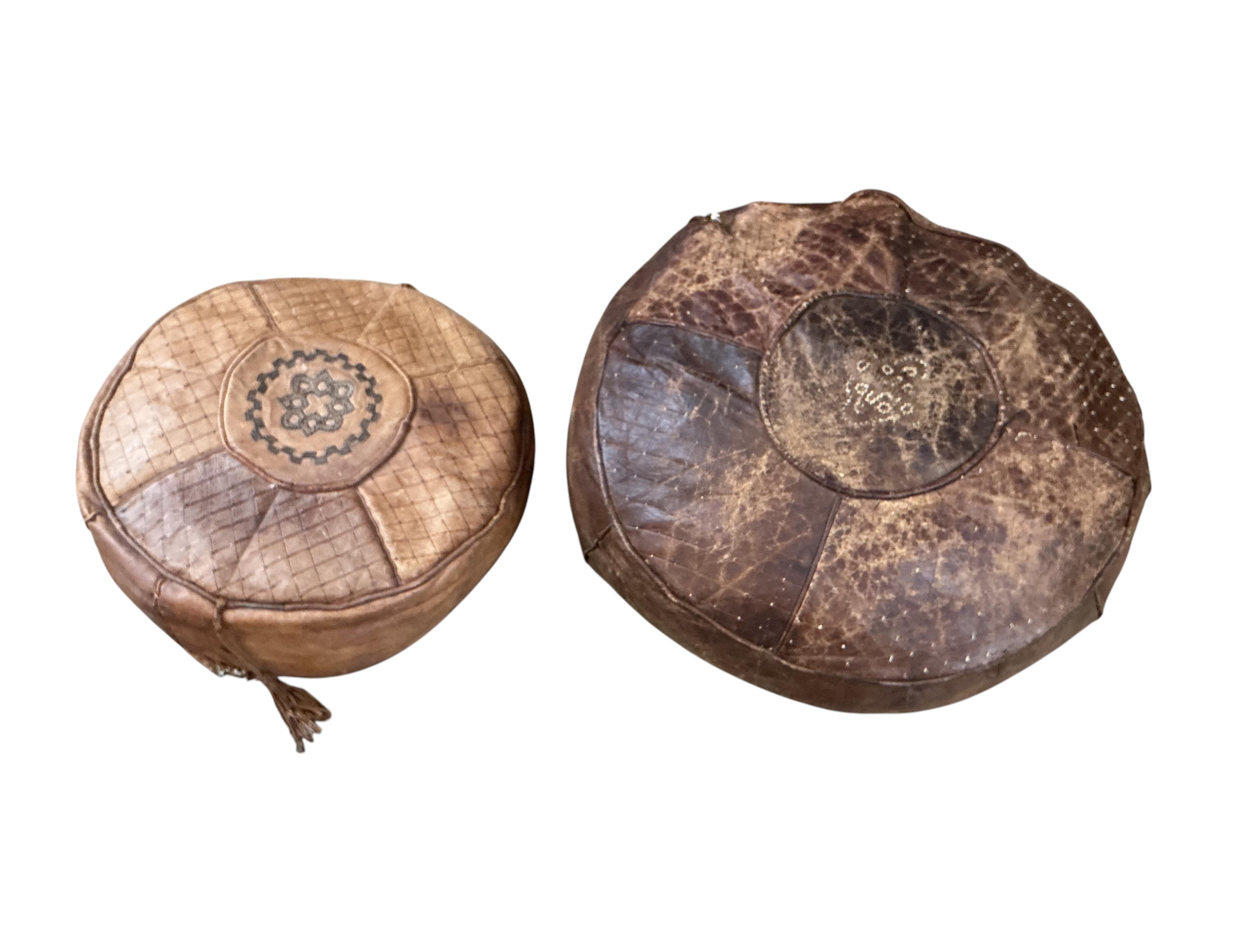 Five vintage Egyptian leather pouffe / footstools, largest diameter 60cm